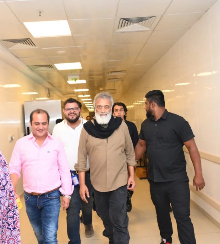 Dignitaries walking through an event venue